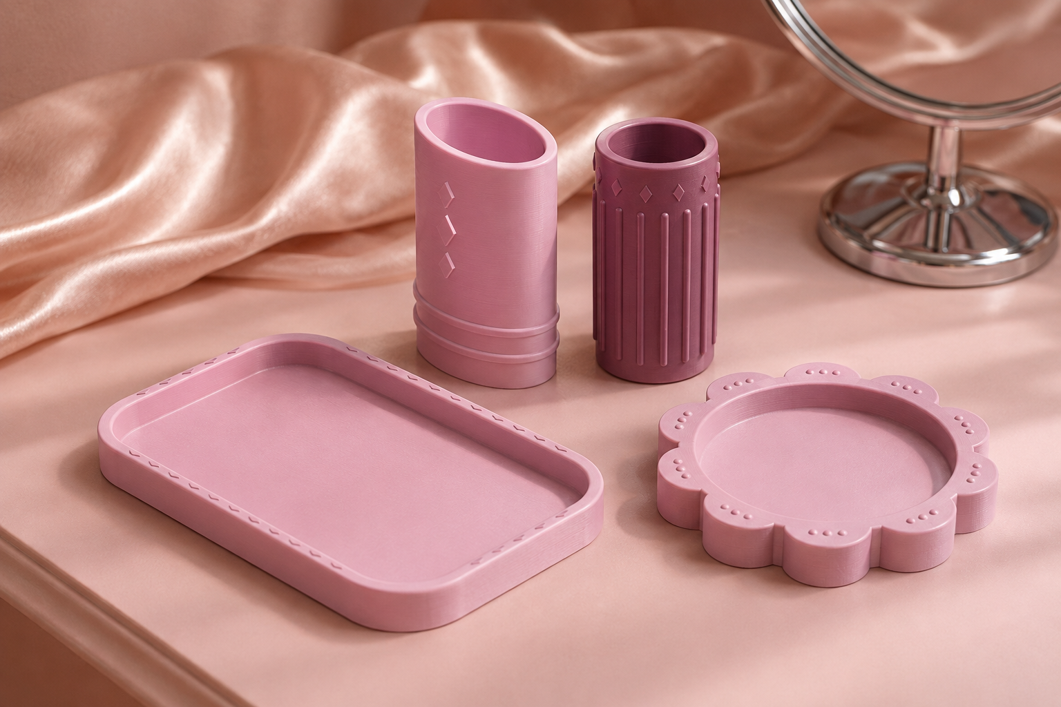 Concept scene of embossed sleeves and catchall dishes on a pink satin vanity